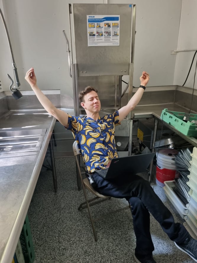 Seen here taking a moment of zen by an industrial dishwasher. You know, normal everyday stuff.